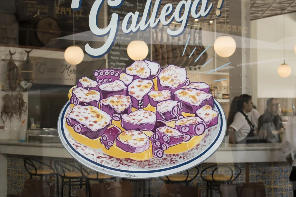 Pulpo a la gallega rotulado a mano sobre cristal de bar restaurante